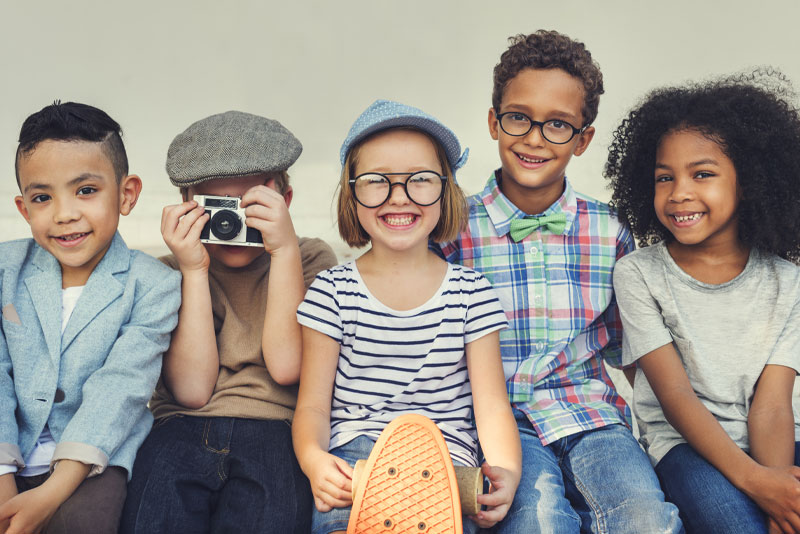a group of children smiling.