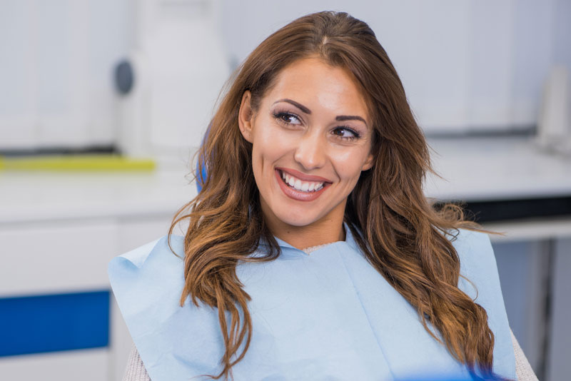 a dental implant patient after a procedure smiling.