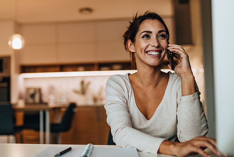 female patient on the phone with dental practice